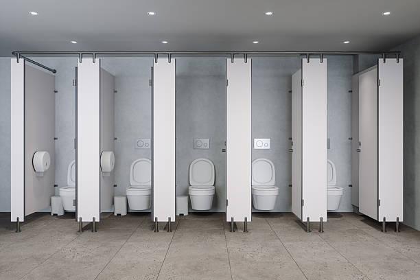 White Public Restroom Stalls With Toilets In Modern Clean Interior